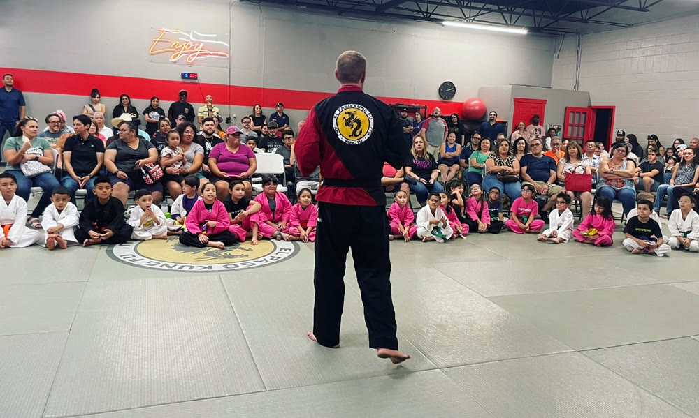 Instructor addressing students and families at El Paso Kung Fu